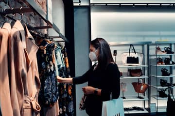 As UK lifts coronavirus restrictions, some retailers urge to keep wearing masks