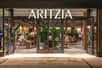 Aritzia swings to Q2 loss, but revenues edge higher