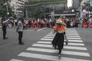 A Jakarta crosswalk turns catwalk as teens make fashion and social statments