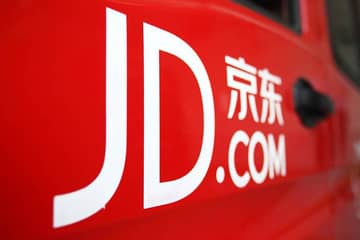 JD.com net revenues surge, loss widens