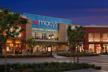 Macy's reports positive comparable sales growth, initiates restructuring plan
