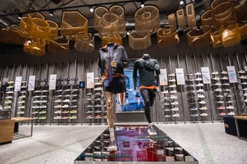 Adidas cuts outlook, winds down Russia operations