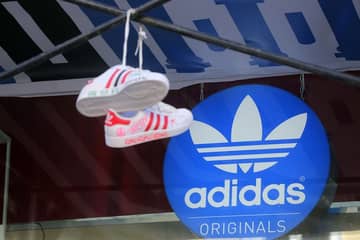 Adidas Group закроет по всему миру на 12 проц больше магазинов, чем планировала