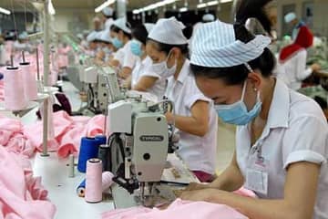 Les investisseurs chinois rachètent des usines textiles du Vietnam pour profiter du TPP