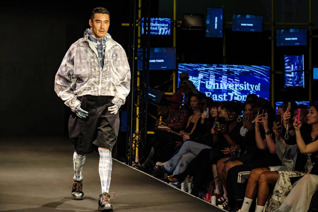 Hu Bing wearing a design by Danis Thapa at the University of East London graduate show. London Fashion Week June 2024.