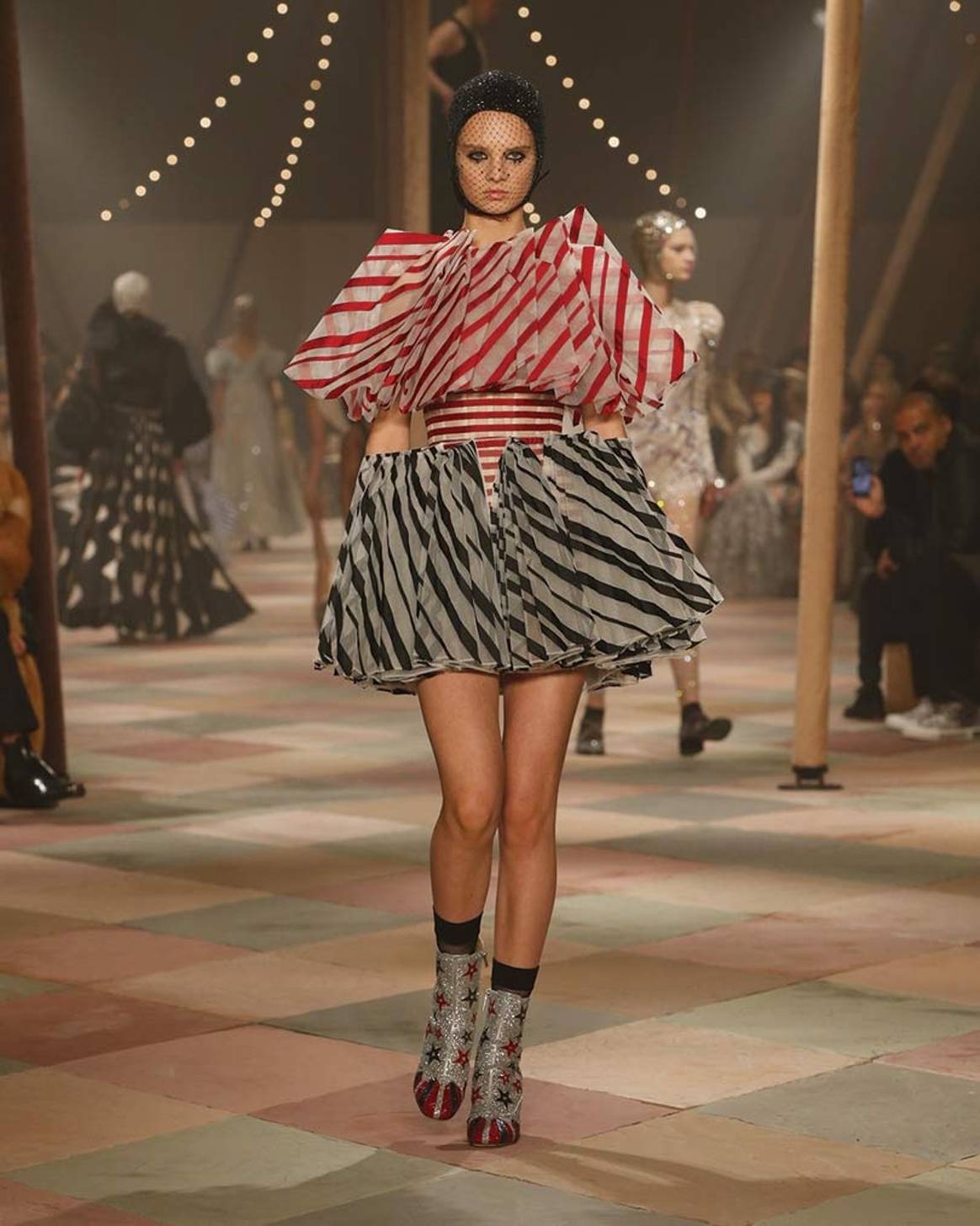Fashion rolls up for Dior's chic strongwoman circus