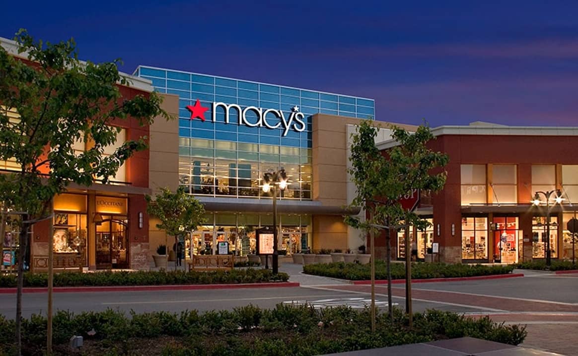 Macy's reports positive comparable sales growth, initiates restructuring plan