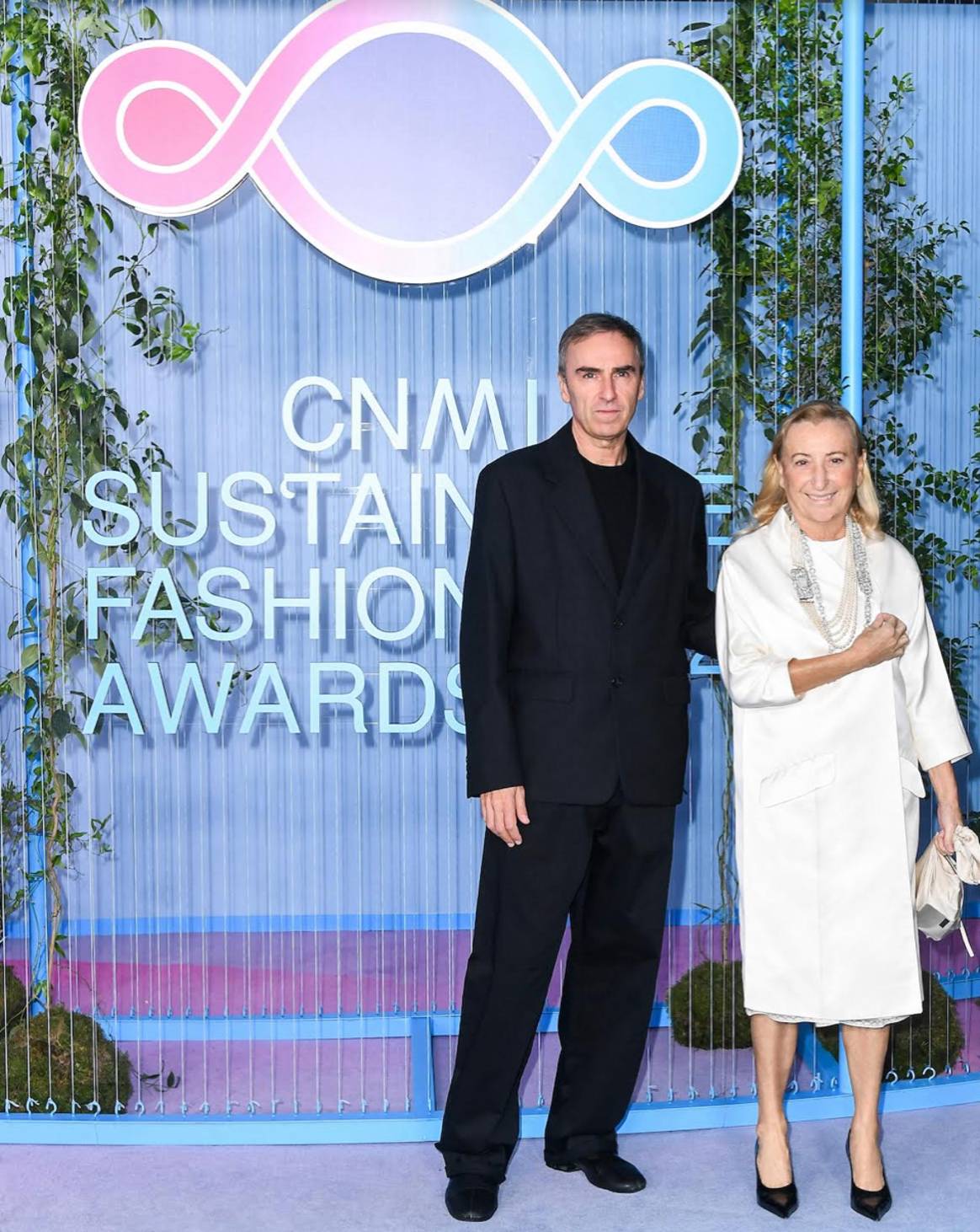 Image: Raf Simon and Miuccia Prada at the CNMI Sustainable Fashion Awards