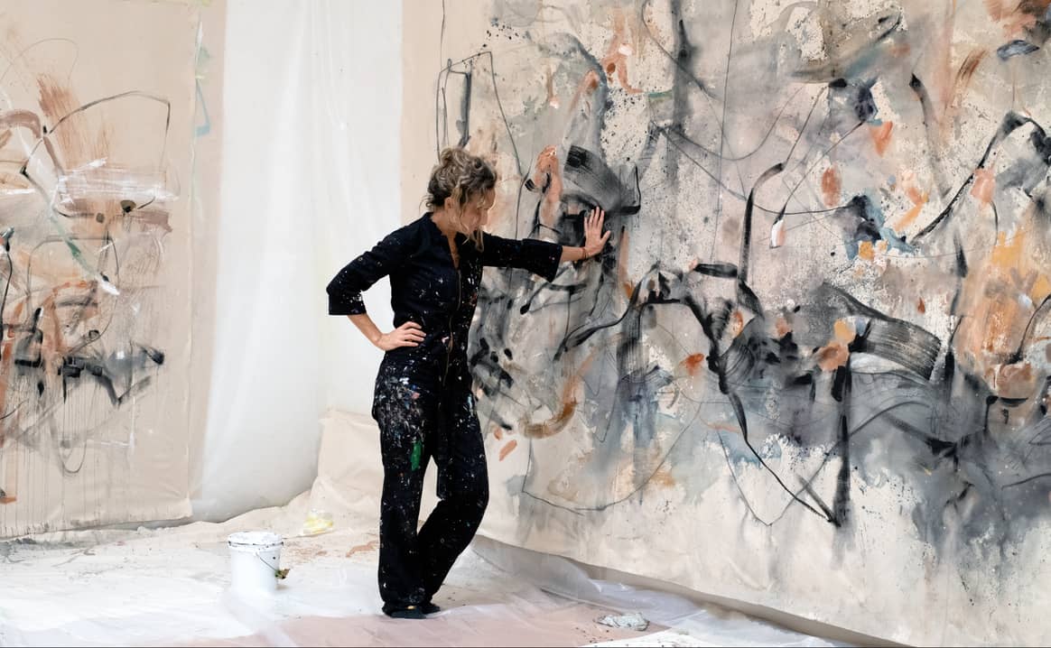 Vicky Barranguet with one of her paintings. Image: Koltson