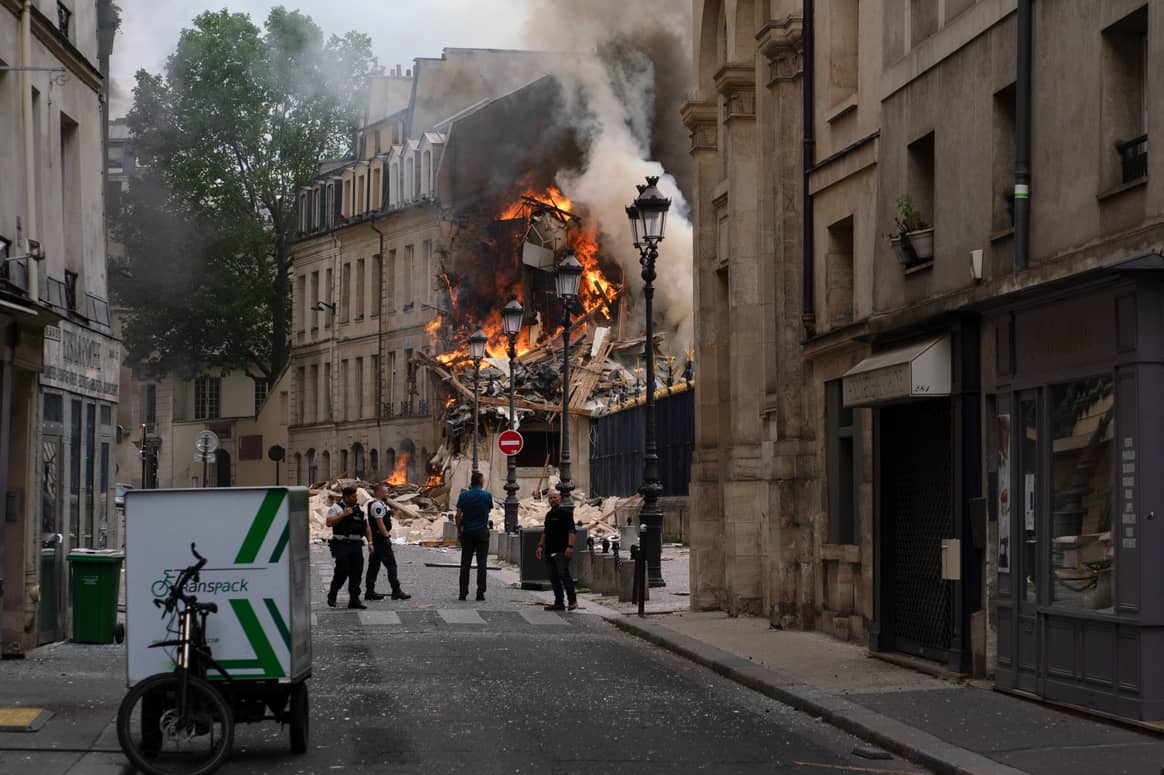 Credits: Smoke billows from the rubbles of a building at Place Alphonse-Laveran, location of the Paris American Academy, in Paris, on June 21, 2023. (Photo by Abdulmonam Eassa  / AFP)