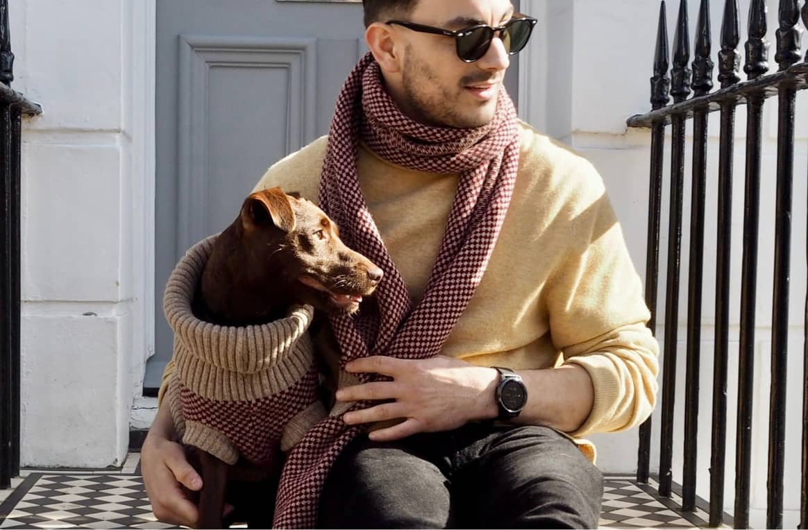 Dog dad and pup in matching sweater and scarf. Credits: Wag & Wool