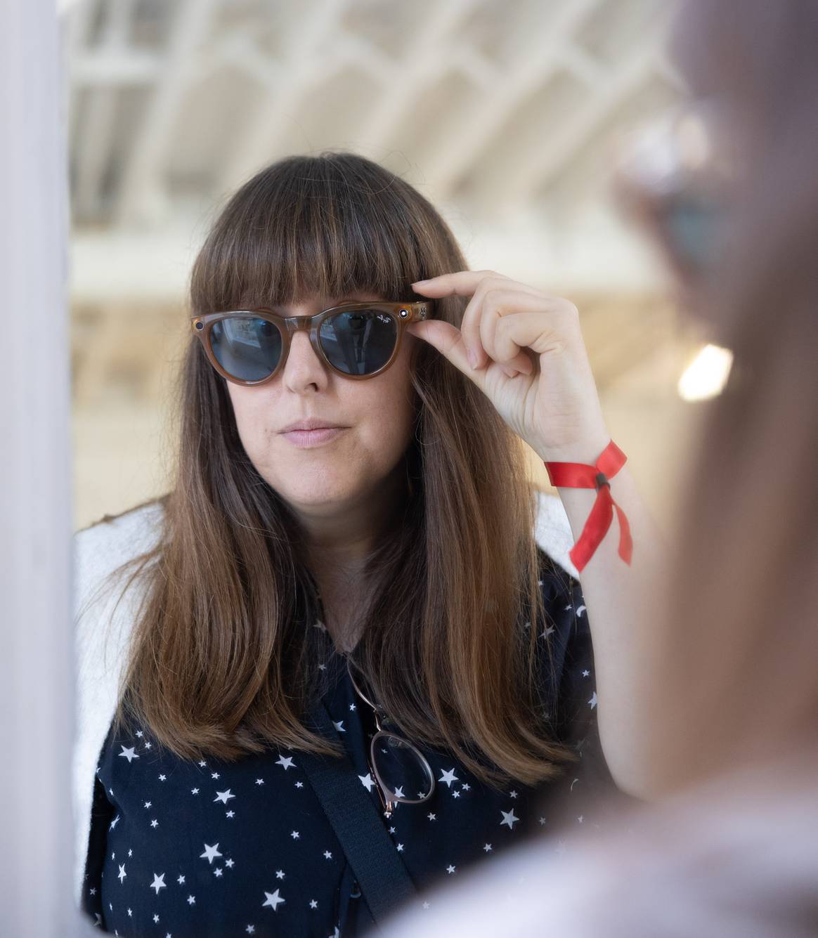 FashionUnited editor Danielle Wightman-Stone trying on the Ray-Ban Meta smart glasses