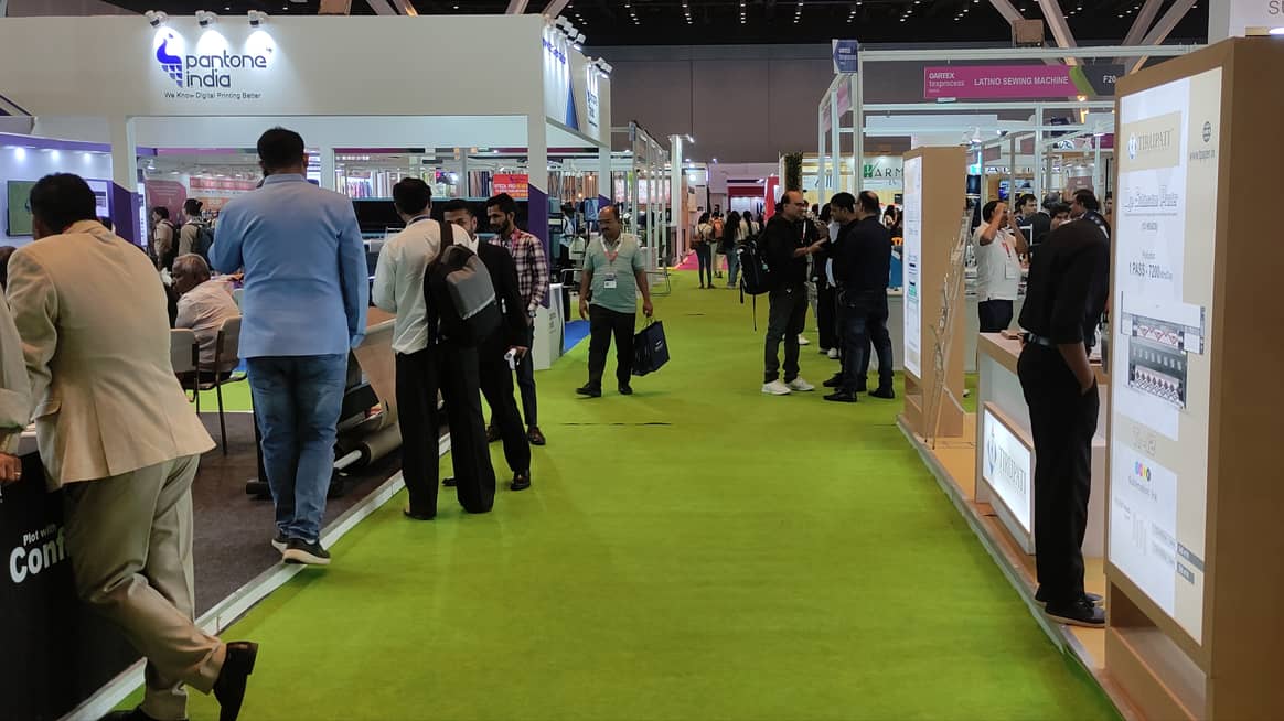 The two halls were separated by carpet colour - bright green for Gartex and pink for the Denim Show.