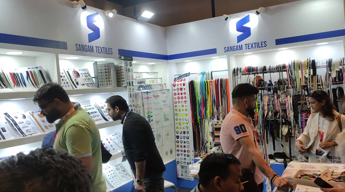 Visitors were checking out buttons, zippers and trims at the Sangam Textiles booth.