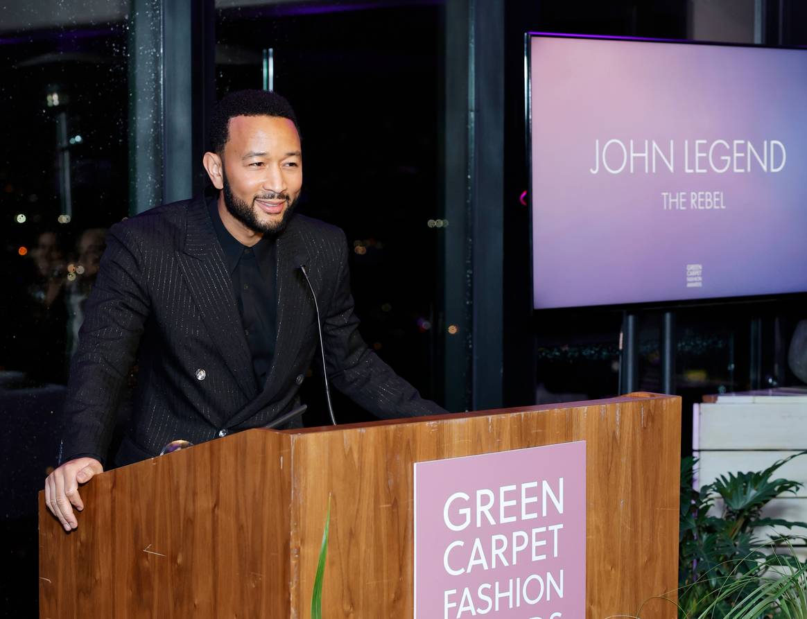 Honoree John Legend speaks onstage during the 2024 Green Carpet Fashion Awards