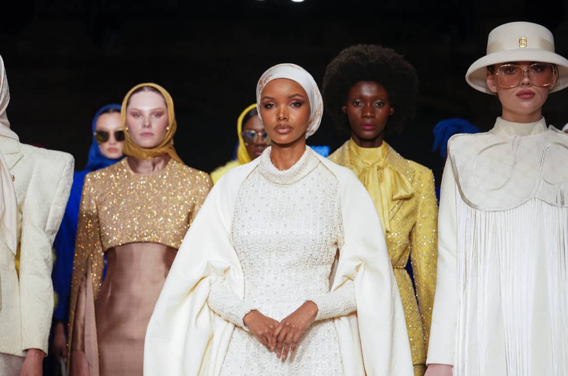 Modest fashion icon Halima Aden walked for the Indonesian brand Buttonscarves, in a unique off-white piece.