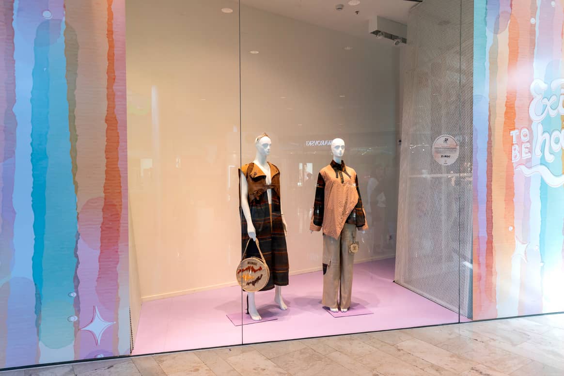 Window display showing Álvaro Castillo's winning collection at Puerto Venecia shopping centre in Zaragoza, Spain.